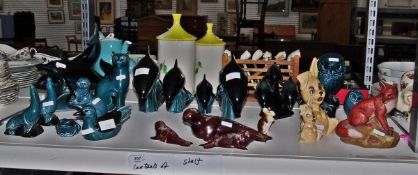 Quantity of Poole models including seals, leaping dolphins, an otter, owls, a cat, a frog,