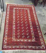 Eastern wool rug, decorated with geometric designs in green,