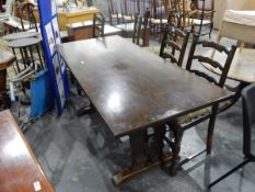 Reproduction oak refectory-style dining table and a set of six oak reproduction ladderback dining