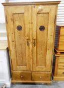 Old pine two-door food cupboard having two drawers to base and standing on turned bun feet,