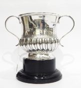 Silver two-handled cup by Atkin Bros, Sheffield 1914 of half-fluted form with reeded scroll handles,