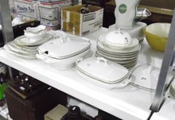 Limoges part dinner service comprising tureens, serving plates, dinner plates, gravy boat etc.