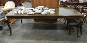 Panamanian hardwood (mahogany family) extending dining table on cabriole legs and hoof-type feet,