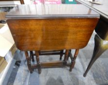 Oak fall-flap gate-leg table on turned supports,