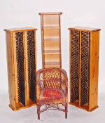 Three CD racks and a child's cane tub chair (4)