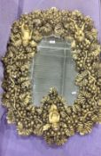 Mirror within a moulded fruiting vine high relief moulded frame