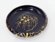 Early 20th century Japanese lacquer bowl of circular form, decorated with gilt prunus blossom,