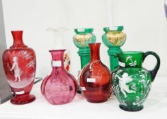 Cranberry glass vase of baluster form painted with white enamel decoration of a girl in the style