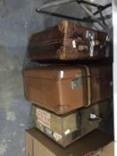 Three various travelling cases with shipping labels