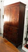 Early 19th century mahogany linen press having flat moulded cornice, over two panelled doors,