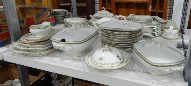 Limoges part dinner service comprising tureens, serving plates, dinner plates, gravy boat etc.