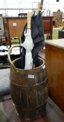 Brass-banded barrel umbrella stand complete with two umbrellas and a walking stick