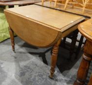 Mahogany drop-flap dining table with moulded border, frieze drawer,