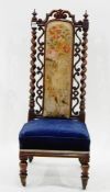 Victorian mahogany-framed nursing chair having carved and pierced crest-rail over spiral turned
