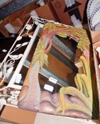 Mirror within a carved frame, depicting an exotic forest,