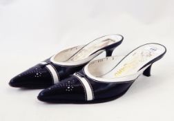 Pair of Salvatore Ferragamo kittenheeled leather mules in black and white