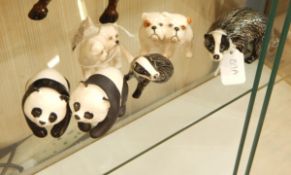 Two Beswick model badgers, a Beswick model group of two cairn terriers,