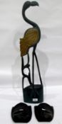 Pair of carved African wooden masks and a carved wooden model of a heron (3)