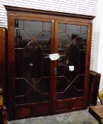 Georgian-style mahogany glazed bookcase with dentil cornice,