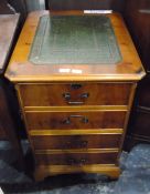 Walnut veneer filing cabinet, the top with inset writing surface,