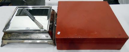 Early 20th century silver-coloured metal square cake stand with inset bevelled glass panel,