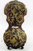 Victorian walnut-framed lady's chair having shaped upholstered pad back, circular shaped seat,