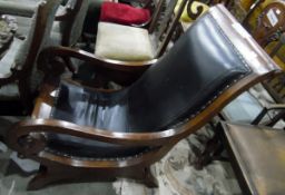 Late 19th/early 20th century mahogany and studded leather upholstered open armchair with scroll