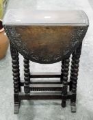 Late 19th century oak fall-flap Sutherland-style table with lunette carved border,