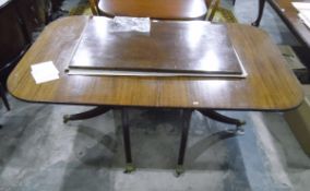 Georgian-style twin-pedestal mahogany dining table with reeded edge, on turned gun-barrel supports,