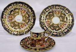 Royal Crown Derby Imari patterned plate, another and a Crown Crown Derby teacup,