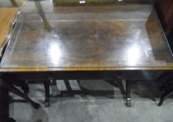 Georgian-style mahogany sofa table with lyre-shaped supports united by a central stretcher,