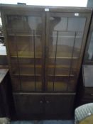 20th century oak glazed bookcase, the pair of astragal-glazed doors enclosing adjustable shelves,