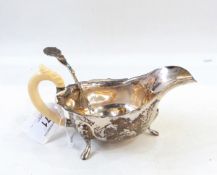 Silver sauce boat with ivory handle,