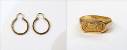 Egyptian gold-coloured ring of signet ring design decorated with hieroglyphics with Egyptian gold