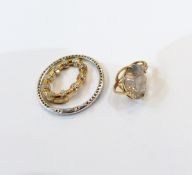 Circular diamond encrusted pendant,