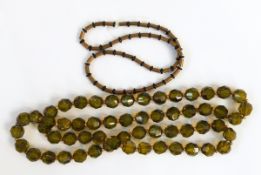 Faceted green bead necklace, a millefiori glass elongated bead,