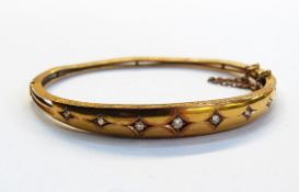 15ct gold and diamond bangle set seven graduated old cut diamonds, in graduated bar top,