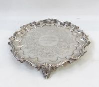 Silver presentation salver, circular with foliate scroll border,