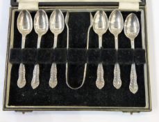 George V silver set of six coffee spoons with sugar nips, foliate pattern, boxed,