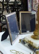Pair of modern silver-mounted photograph frames, each rectangular with bead and bar borders,