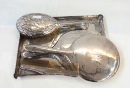 George V silver-backed hand mirror with floral and ribbon decoration, Chester 1912,