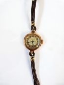 Lady's 9ct Buren gold wristwatch with leather strap