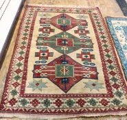 Turkish Kars wool rug with triple totem, on an ivory ground with geometric star and cross motifs,