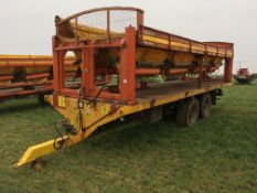 Larrington 8 box loaders with yellow flat bed trailer on 385/65R22.