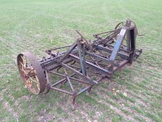 Rigid tine linkage harrow