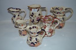 Five Masons Blue Mandalay Jugs and One Red Mandalay Jug