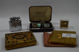 Two Compacts, Two Pairs of Cufflinks and a Lighter