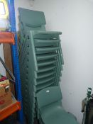 Eighteen Green Plastic Stackable Chairs