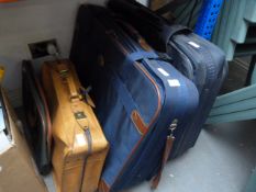 Two Large and One Small Travelling Suitcases