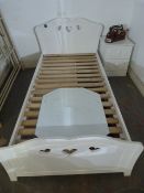 Child's Single Bed and White Headboard with Part Cutouts